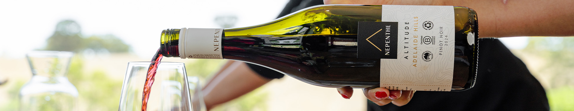 Bottle of Nepenthe being poured